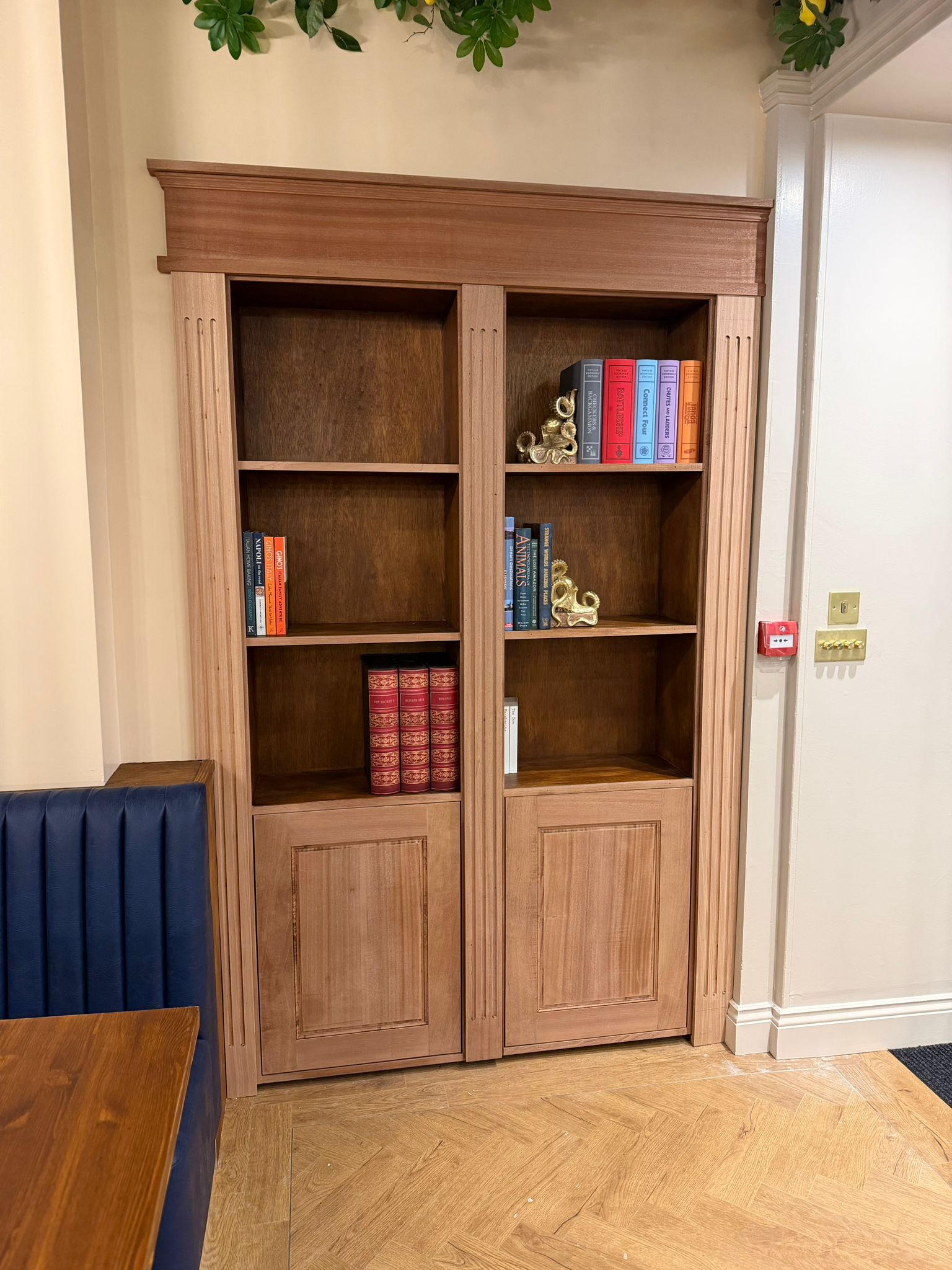 Bespoke mahogany secret-door bookshelf at Stefani's Pizza, Blackpool